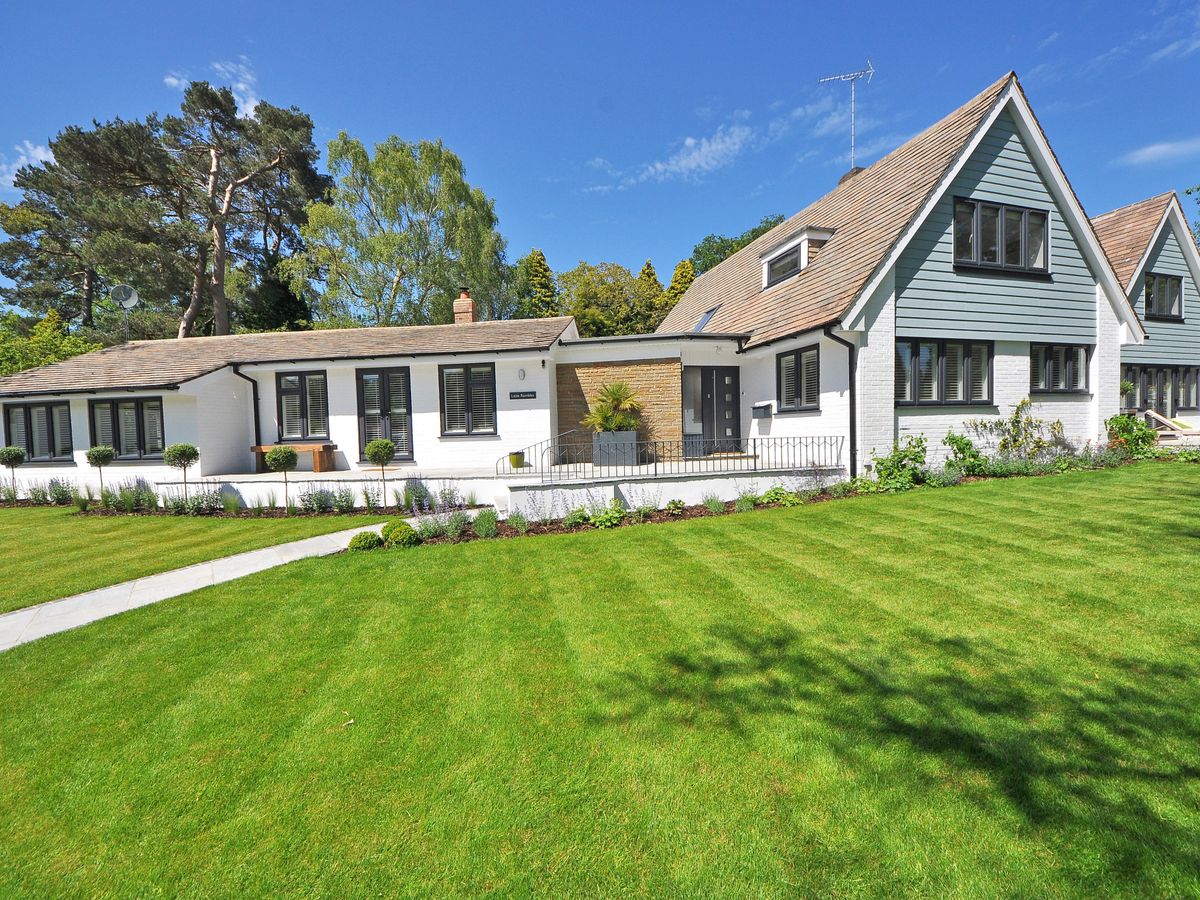 Professionally landscaped residential yard with a lush green lawn